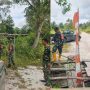 Anggota Koramil 414-01/Tanjungpandan Serka Astiyandi Cek dan Siapkan Material Perbaikan Jembatan Air Mendaran di Desa Air Pelempang Jaya