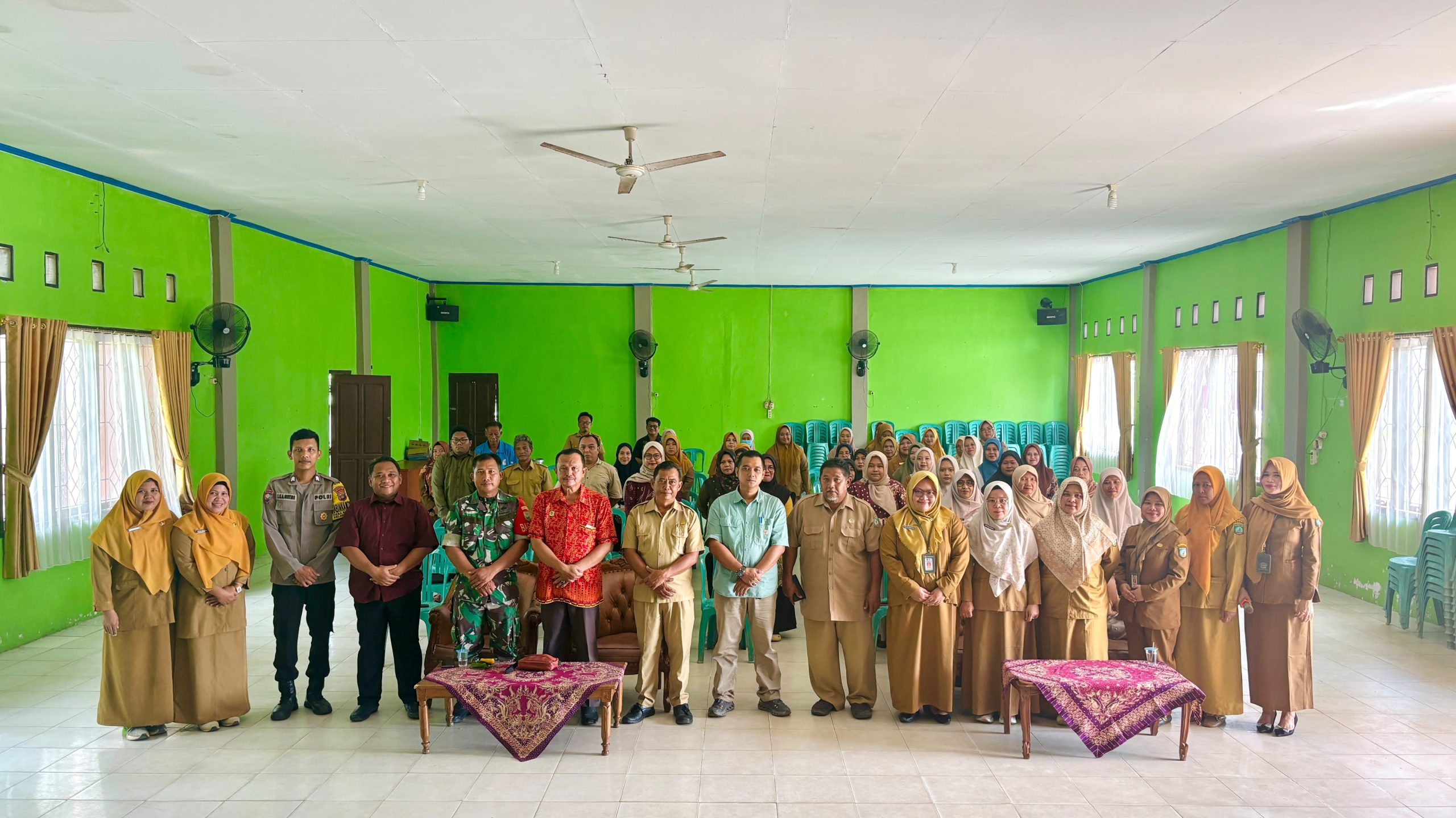 Babinsa Sertu I Kadek Edi P Hadiri Lokmin di Puskesmas Kelapa Kampit 2 AddText 06 23 03.53.43 scaled